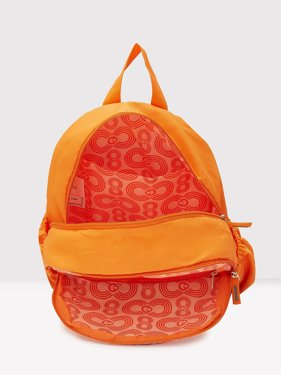 Caprese Xenia Backpack Medium Dual Compartment Orange Printed